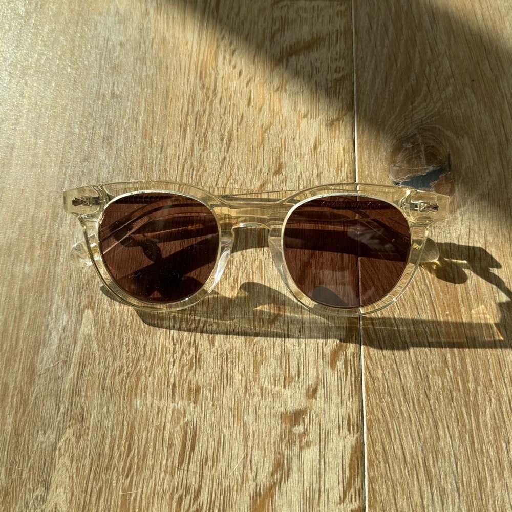 Karen Walker Transparent Frame Sunglasses with Dark Brown Lenses